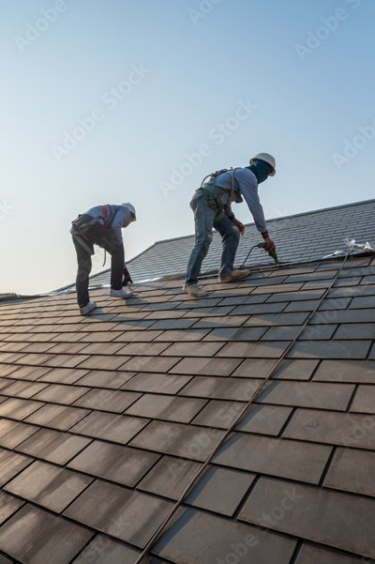 roofers working on roof